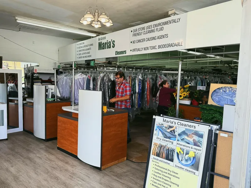 Maria's front counter with garment racks behind it
