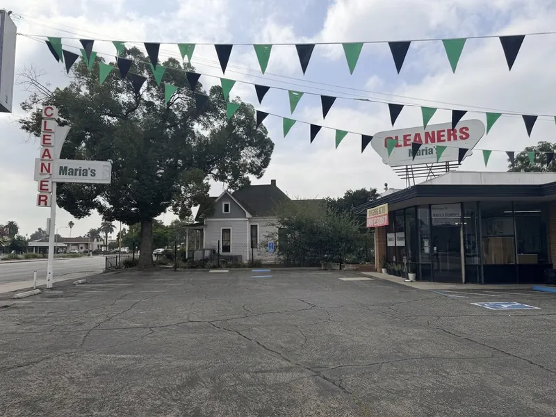 Green and black pennants strung over the shop's parking lot